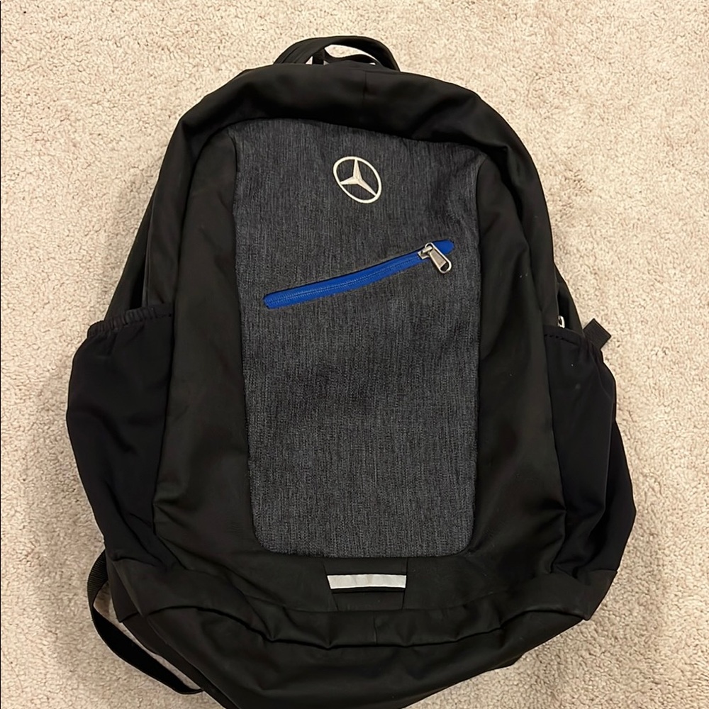 Black and Grey Deuter backpack with Mercedes Benz logo